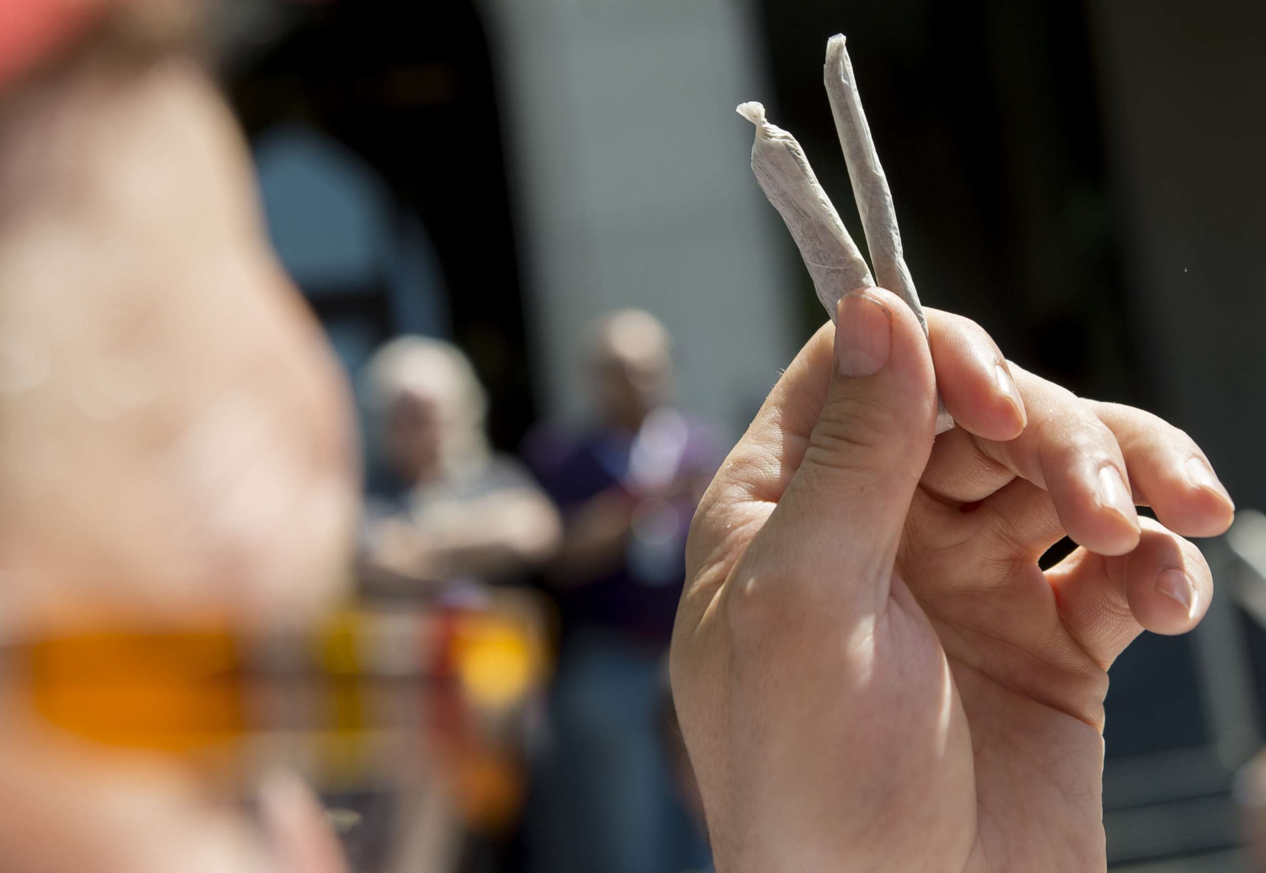 PHOTO: An activist hands out free marijuana joints to D.C. residents who work on Capitol Hill in Washington, D.C., April 20, 2017.