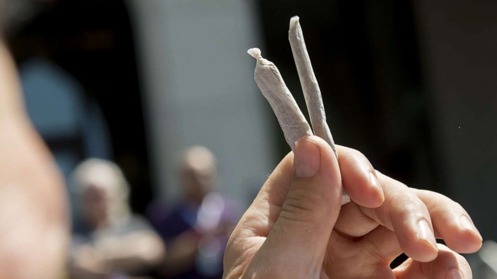 PHOTO: An activist hands out free marijuana joints to D.C. residents who work on Capitol Hill in Washington, D.C., April 20, 2017.