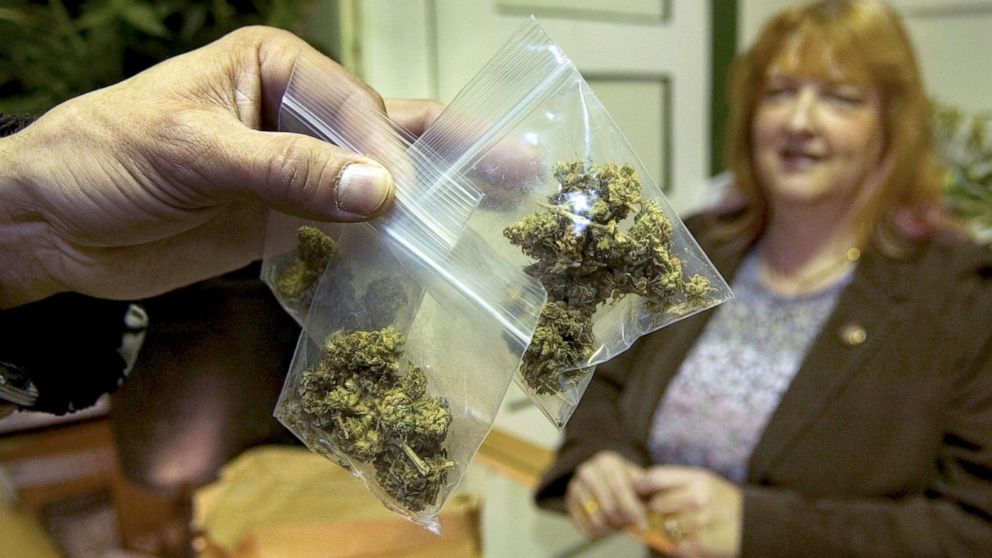 PHOTO: A customer holds up marijuana he bought from a marijuana dispensary in San Francisco, Feb. 4, 2006.  