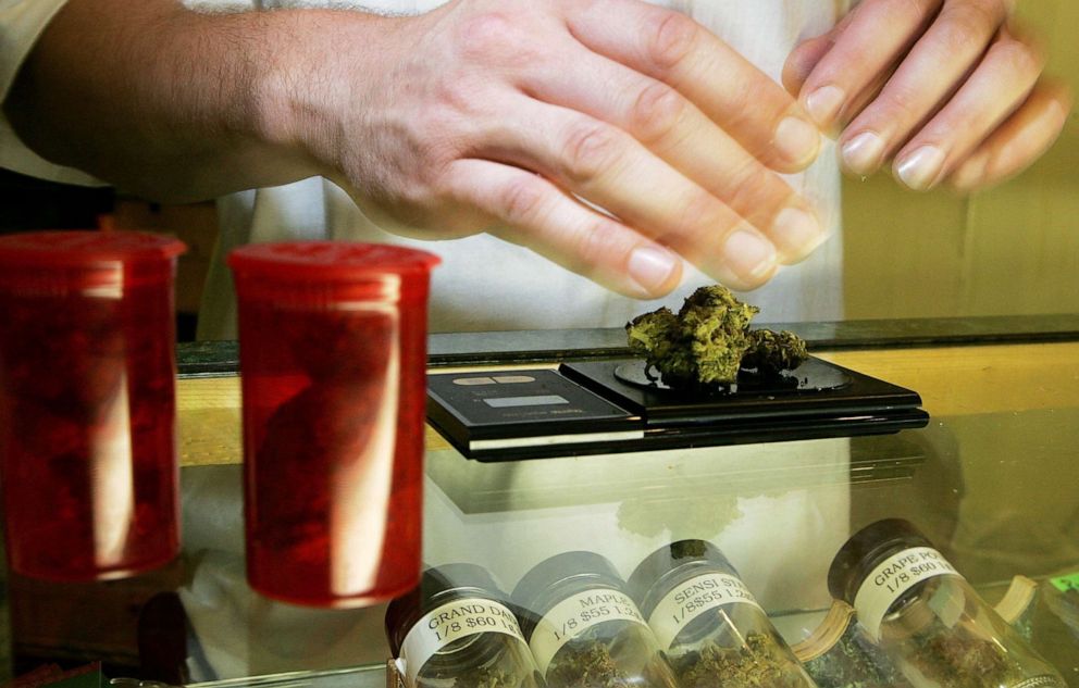 PHOTO:  A worker at the Alternative Herbal Health Services cannabis dispensary weighs medicinal marijuana  in San Francisco, Calif., July 13, 2006.