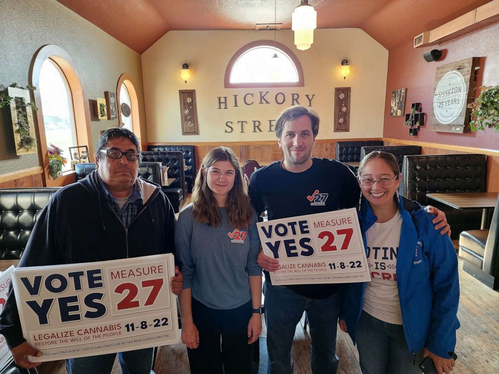 PHOTO: Yes on 27 campaign manager Matthew Schweich (second from right) and deputy campaign manager Quincy Hanzen (second from left) and two Measure 27 supporters at a campaign event in Sisseton, SD, located on the Lake Traverse Indian Reservation.