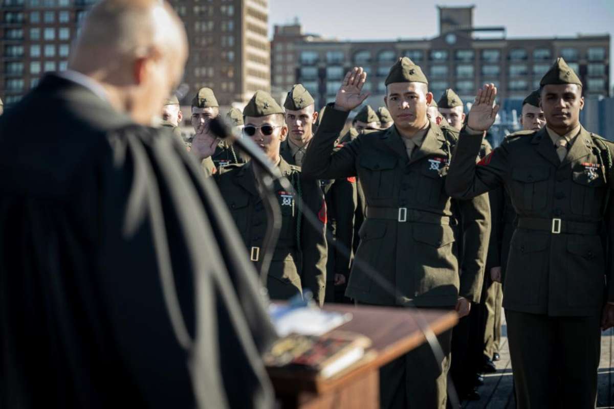 PHOTO: U.S. Marines with 1st Battalion, 8th Marine Regiment, raise their right hand during the Oath of Allegiance aboard the Battleship USS North Carolina Dec. 2, 2022. 
