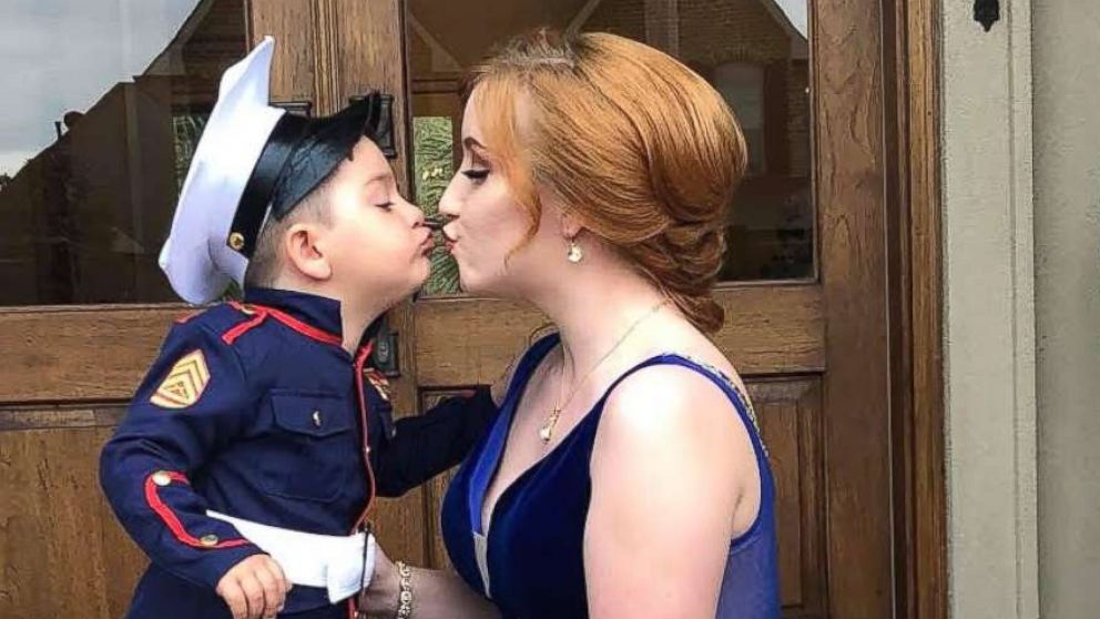 Clay Moak, Jr., 2, took photos with his older brother's girlfriend, Skylar Fontaine, 18, before prom on March 16.