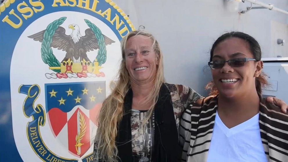 Jennifer Appel and Natasha "Tasha" Fuiava talk to members of the U.S. Navy after they were rescued after being lost at sea for five months, Oct. 26, 2017. 