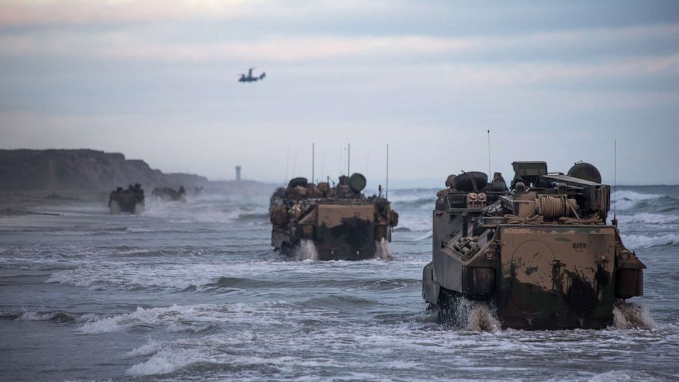PHOTO: Marines with Bravo Company, drive AAV-P7/A1 assault amphibious vehicles through the surf during sustainment training at Marine Corps Base Camp Pendleton, Calif., July 14, 2020.