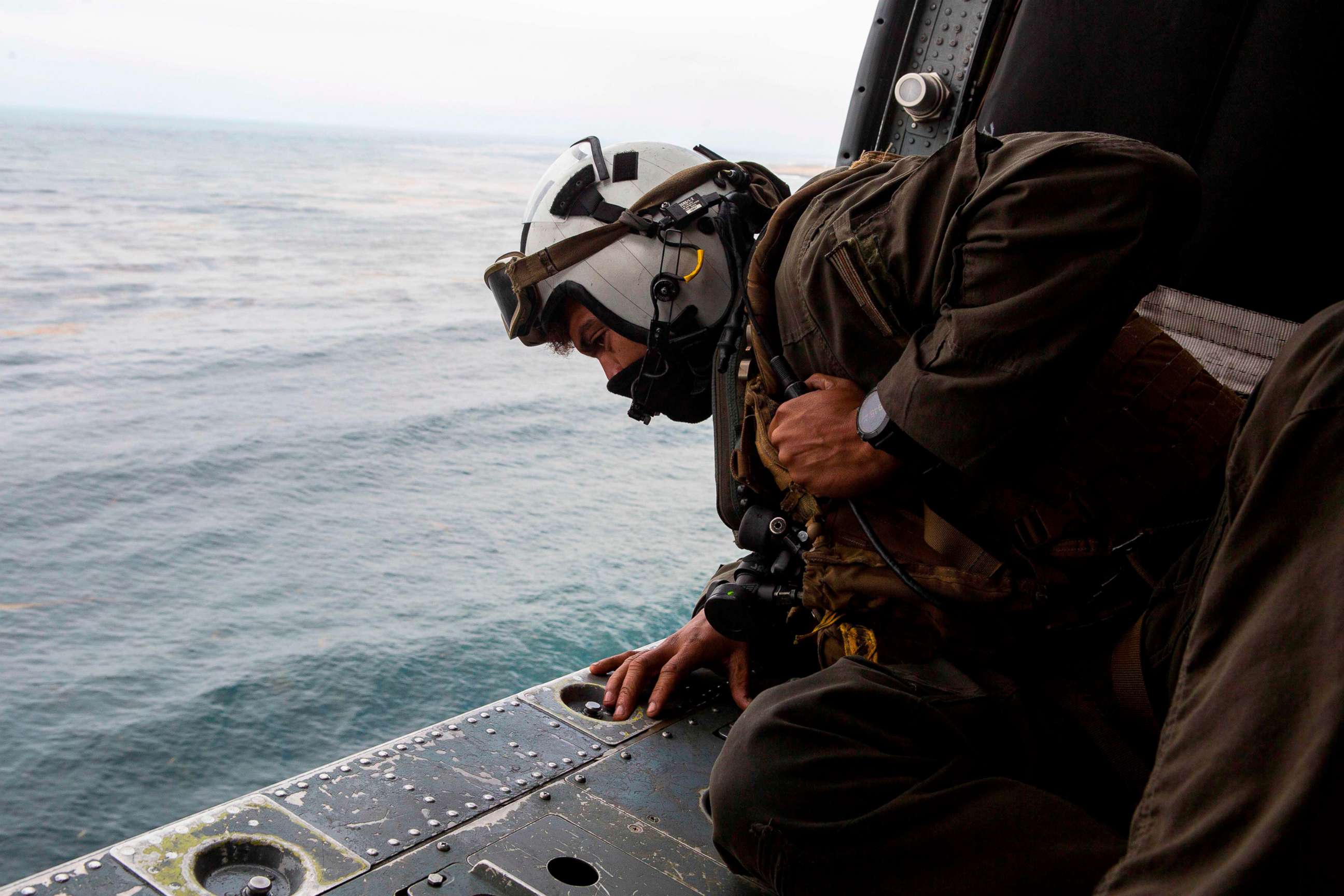 PHOTO: This US Marine Corps photo obtained Aug. 2, 2020 shows Naval Air Crewman  participating in search and rescue relief operations following an AAV-P7/A1 assault amphibious vehicle mishap off the coast of Southern California.