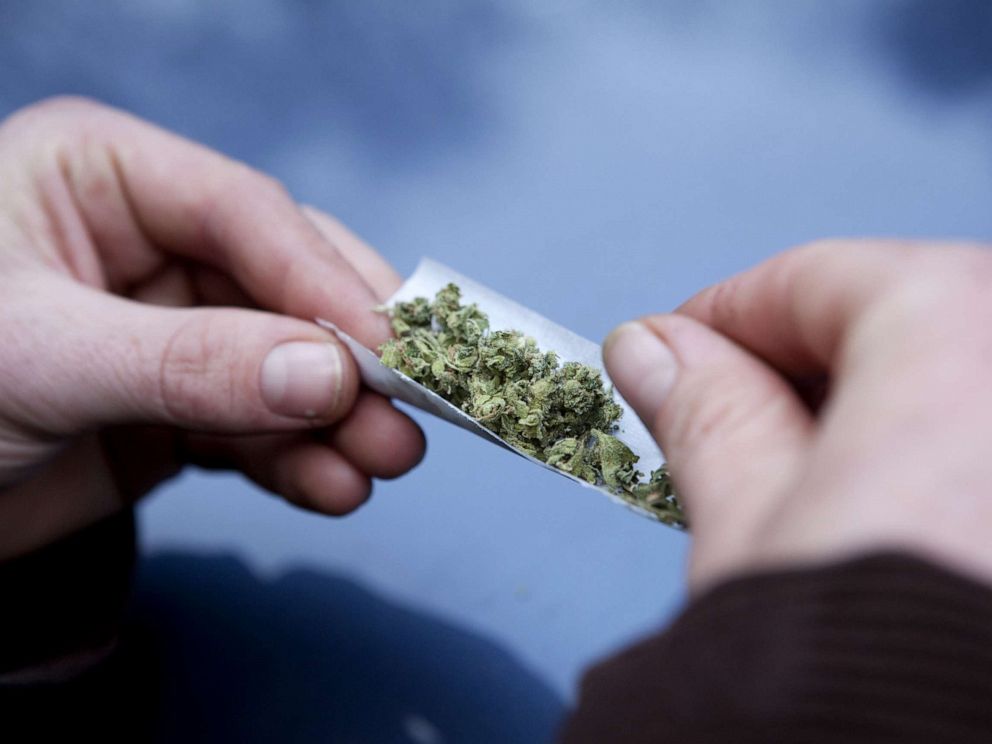 PHOTO: A participant rolls a joint in anticipation of the best joint contest on Dec 11, 2010, in Area 101, Calif.