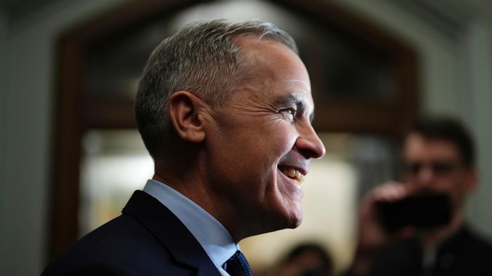 PHOTO: Liberal Leader Mark Carney talks to media as he leaves a caucus meeting in Ottawa, Mar. 10, 2025.