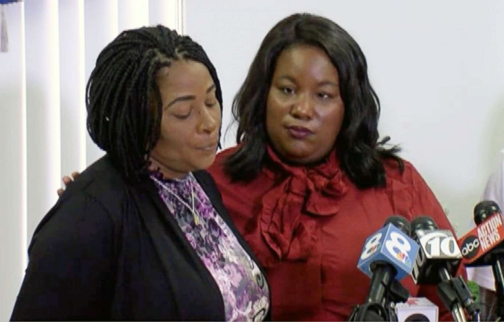   PHOTO: Monica Moore, the mother of Markeis McGlockton, is comforted by family lawyer Michele Rayner at a press conference on July 24, 2018 in Clearwater, Florida. 