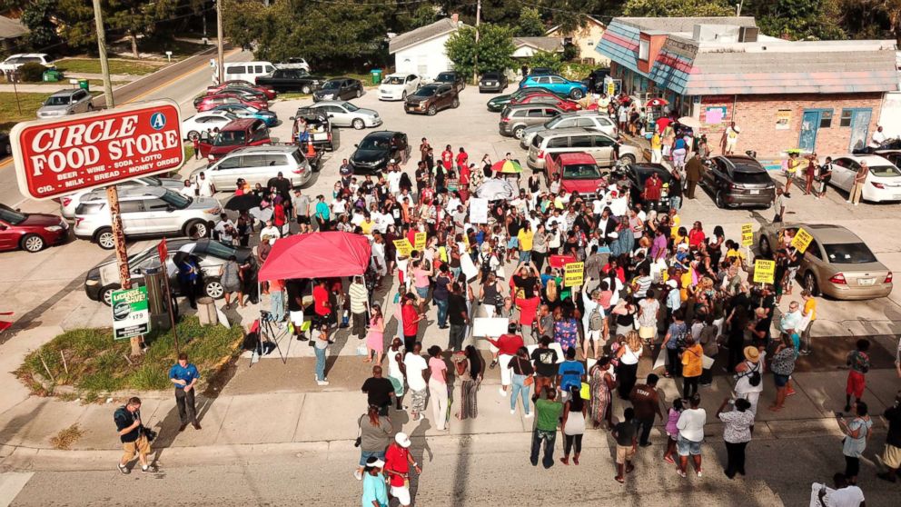 PHOTO: In this Sunday, July 22, 2018 photo, family, friends and demonstrators gather in a parking lot in Clearwater, Fla., where Markeis McGlockton, 28, was shot and killed in an altercation.