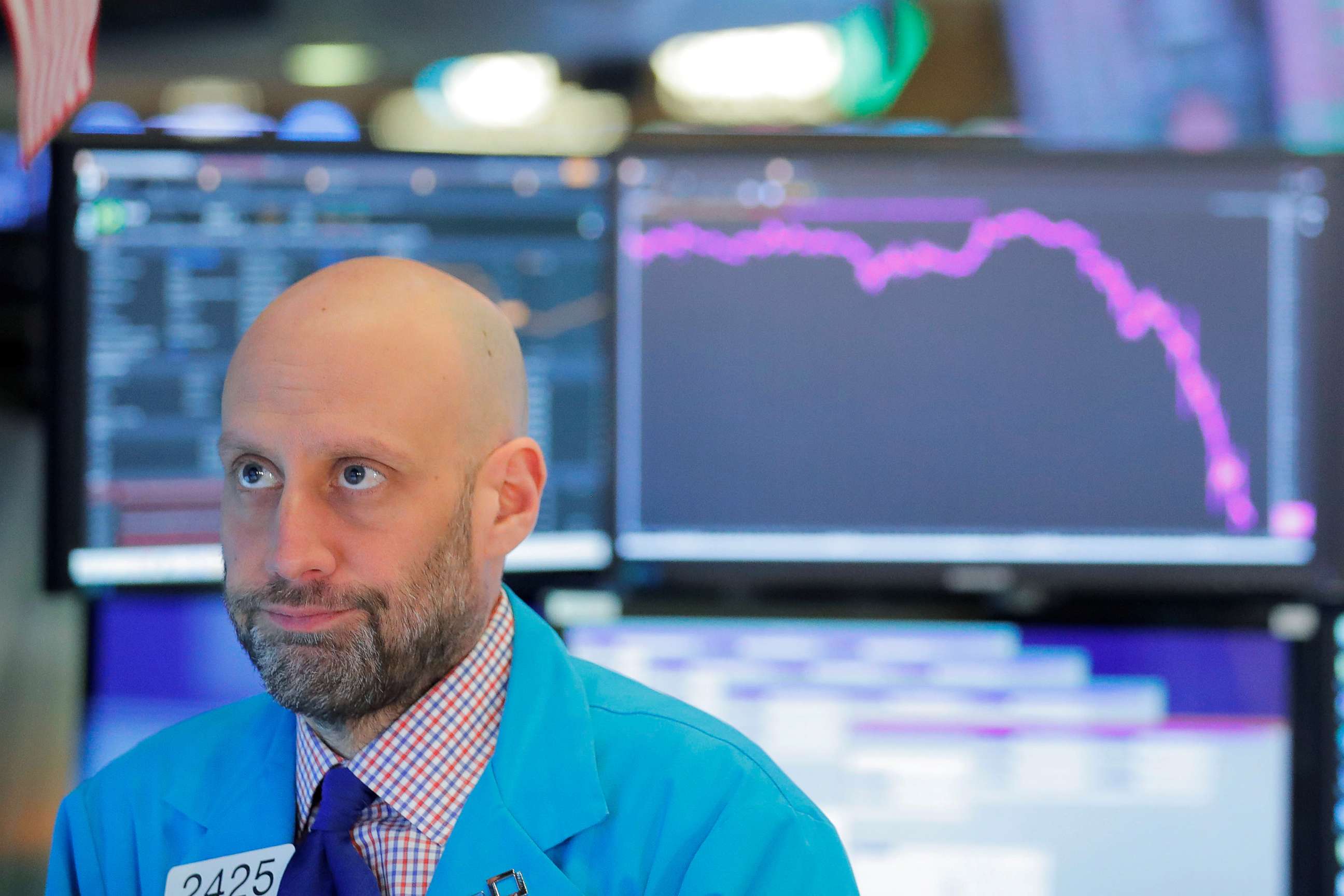 PHOTO: A trader works on the floor of the New York Stock Exchange as coronavirus disease (COVID-19) cases in the city of New York rise, in New York, March 16, 2020.