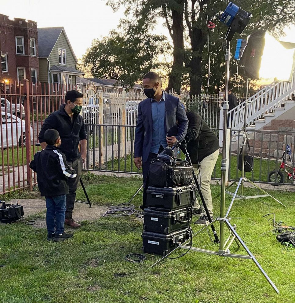 PHOTO: ABC News' Alex Perez and Armando Garcia prepare to interview Alfredo Diaz and his family at their home in Chicago, Illinois.