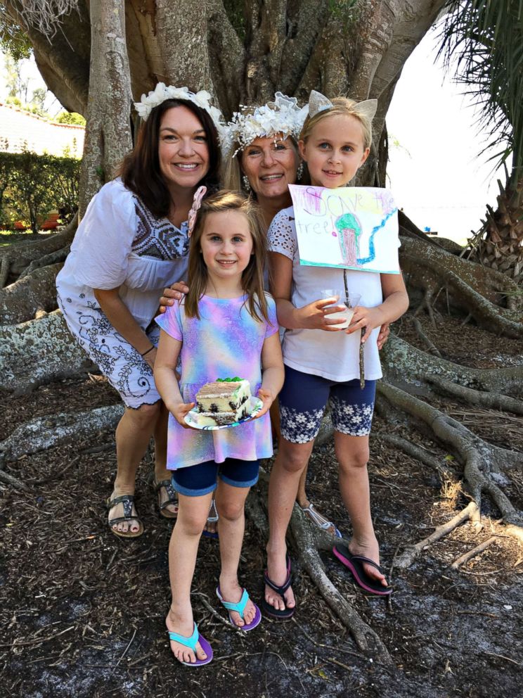 PHOTO: Bride Karen Cooper, center, with neighbors who came out to a wedding ceremony at Snell Family Park on March 24 in Fort Myers, Fla. to support saving the 100-year-old tree.
