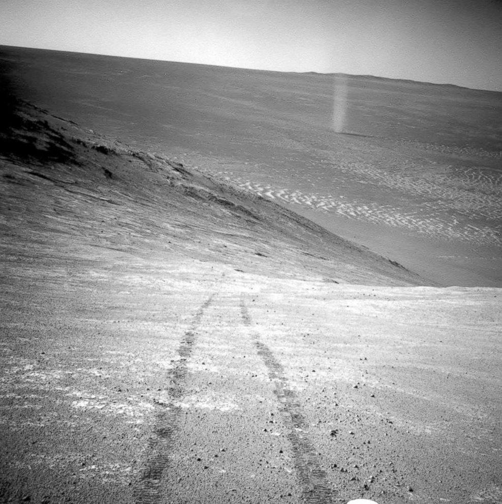 PHOTO: A dust devil in a valley on Mars, seen by the Opportunity rover perched on a ridge.