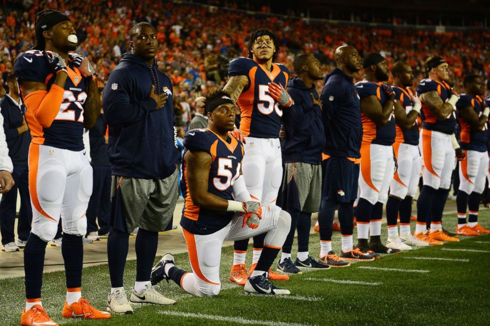 PHOTO: Brandon Marshall (54) of the Denver Broncos kneels as Shane Ray (56) puts his hand on his shoulder for the National Anthem during the first quarter, Oct. 24, 2016. 