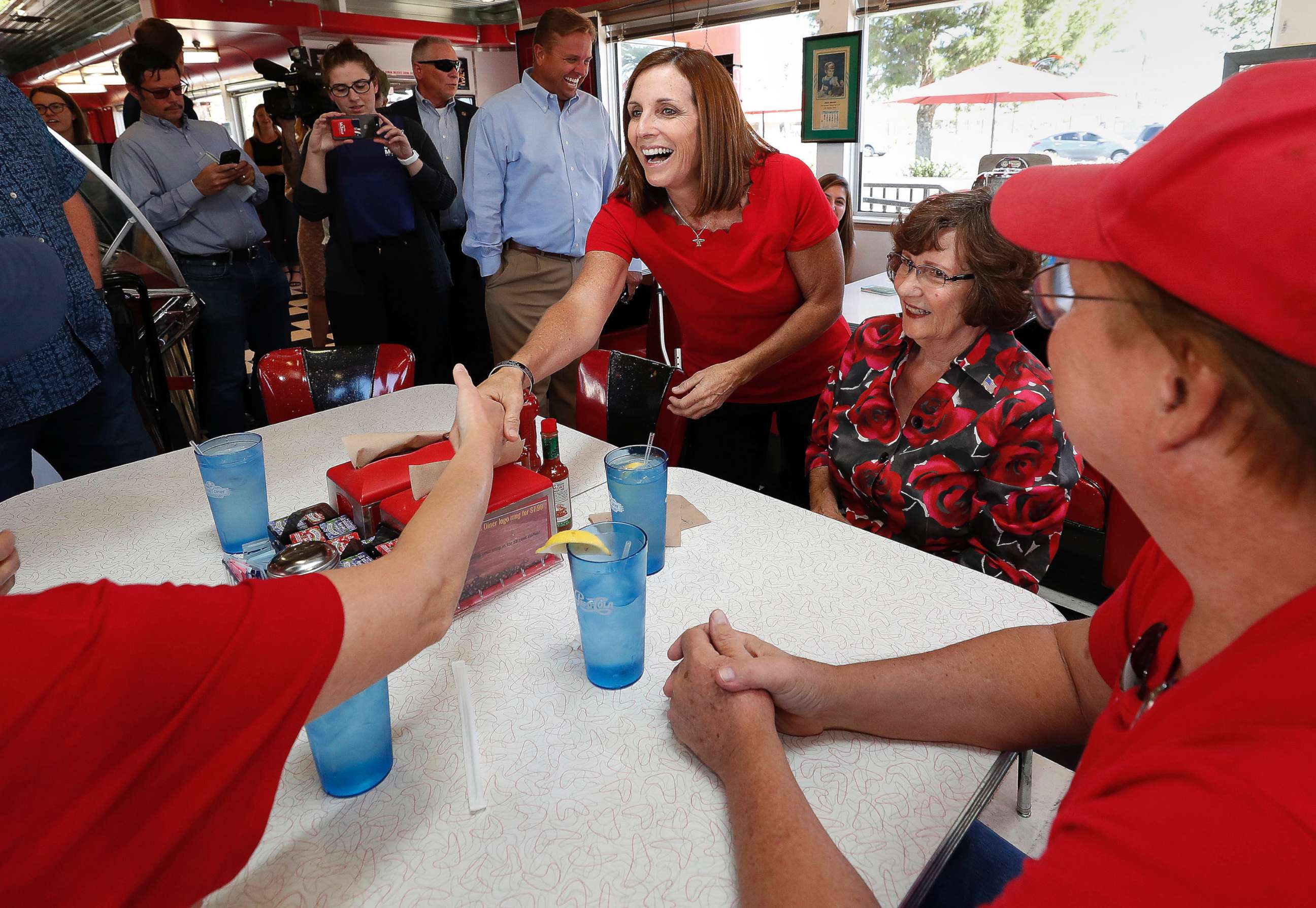 PHOTO: Arizona Republican senatorial candidate Martha McSally, speaks with voters, Nov. 6, 2018, at Chase's diner in Chandler, Ariz.