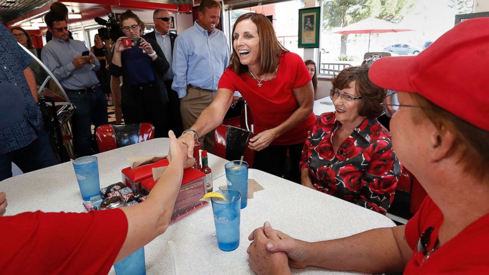 PHOTO: Arizona Republican senatorial candidate Martha McSally, speaks with voters, Nov. 6, 2018, at Chase's diner in Chandler, Ariz.