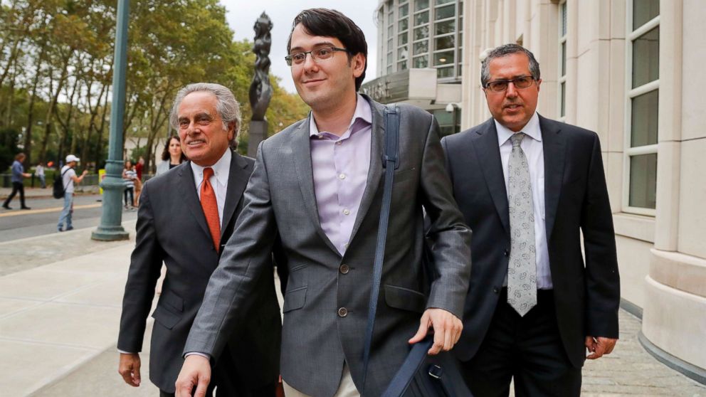 Former biotech CEO Martin Shkreli, center, leaves federal court with his attorney Benjamin Brafman, left, in New York, July 27, 2017.