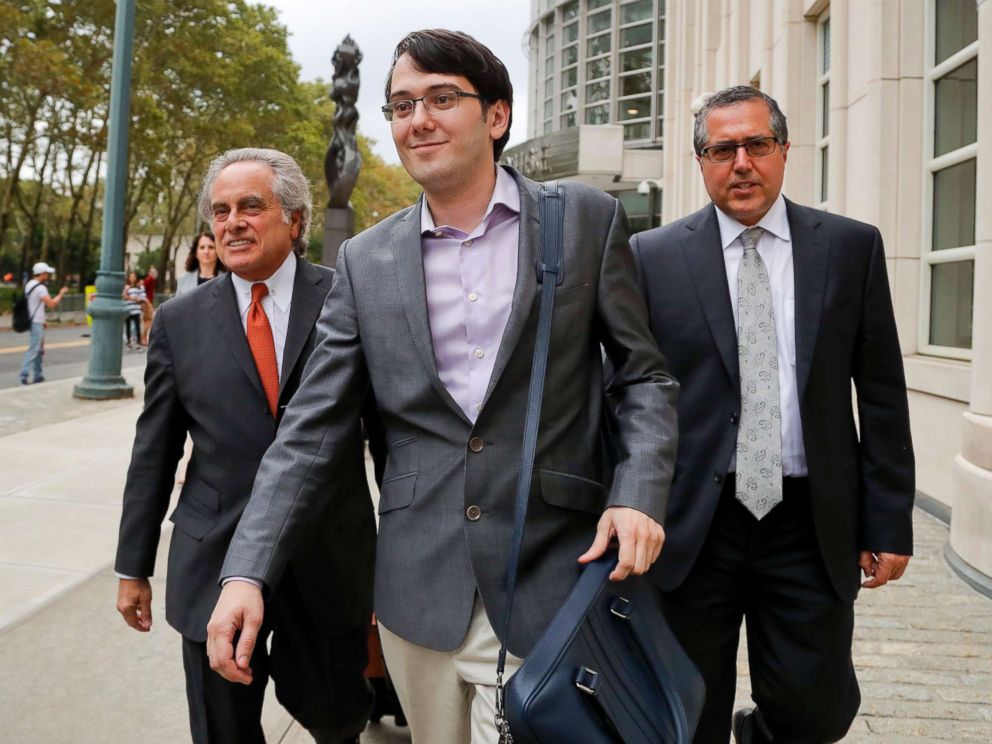 PHOTO: Former biotech CEO Martin Shkreli, center, leaves federal court with his attorney Benjamin Brafman, left, in New York, July 27, 2017.
