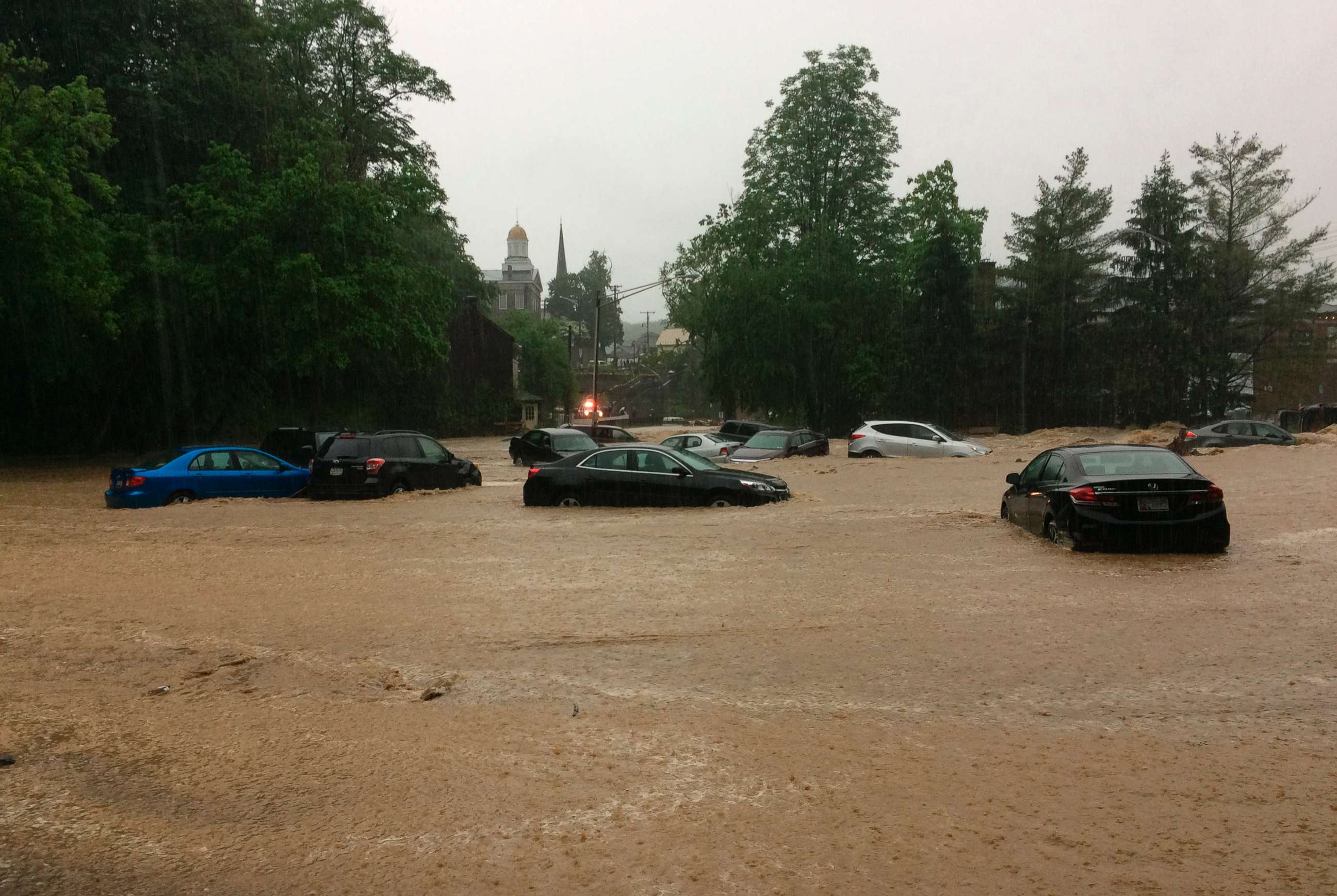 PHOTO: Water rushes through Main Street in Ellicott City, Md., May 27, 2018.