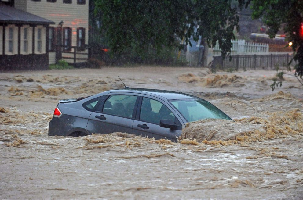 PHOTO: A parked car is flooded in a lot near Main Street and Ellicott Mills Road as a heavy storm caused flash floods in Ellicott City, Md., May 27, 2018.