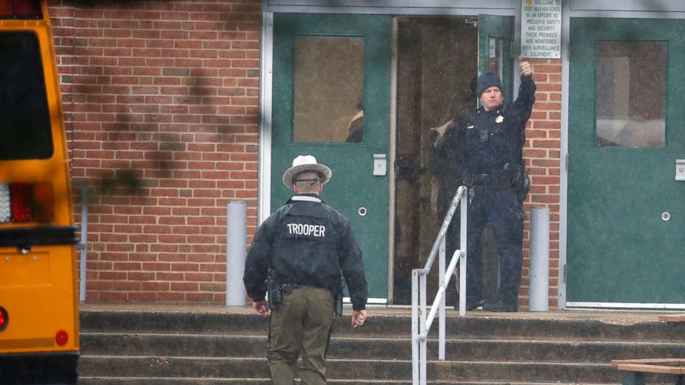 PHOTO: A policeman gives a thumbs-up after moving students into a different area of Great Mills High School, the scene of a shooting, March 20, 2018 in Great Mills, Md.  