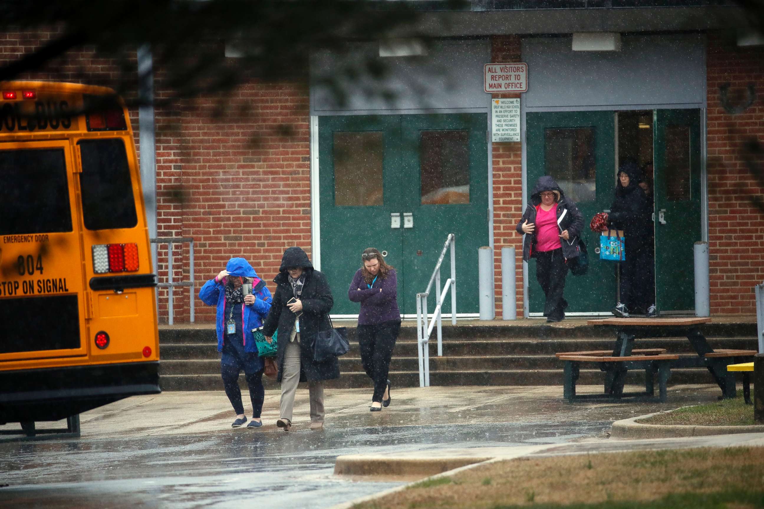 PHOTO: Teachers and school employees depart Great Mills High School, the scene of a shooting, March 20, 2018 in Great Mills, Md. 
