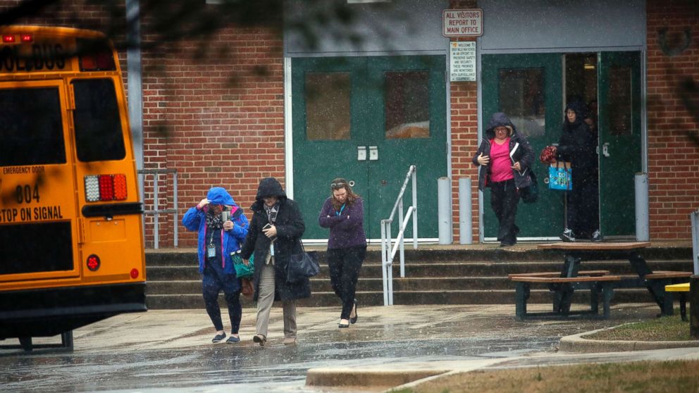 PHOTO: Teachers and school employees depart Great Mills High School, the scene of a shooting, March 20, 2018 in Great Mills, Md. 