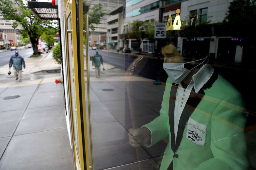 PHOTO: A statue of Elvis Presley is seen wearing a face mask inside a restaurant that remains closed during the new coronavirus pandemic, Wednesday, May 6, 2020, in Towson, Md. 