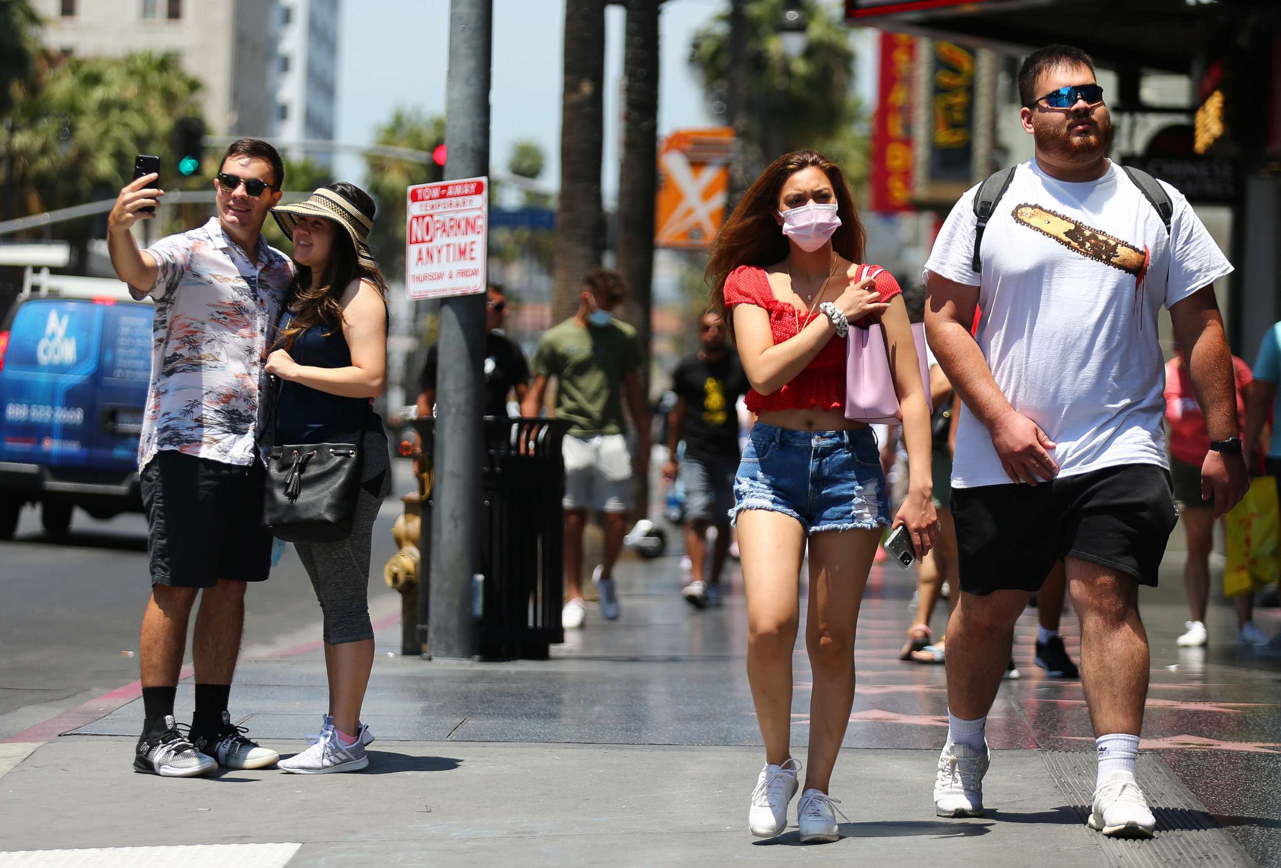 PHOTO: People walk and take photos on Hollywood Boulevard, June 15, 2021, in Los Angeles.