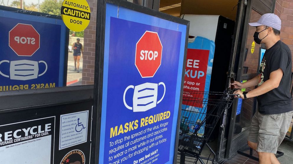 PHOTO: People shop at a grocery store enforcing the wearing of masks in Los Angeles on July 23, 2021. - With the Delta variant pushing US Covid cases back up, fully vaccinated people are wondering whether they need to start masking indoors again. 