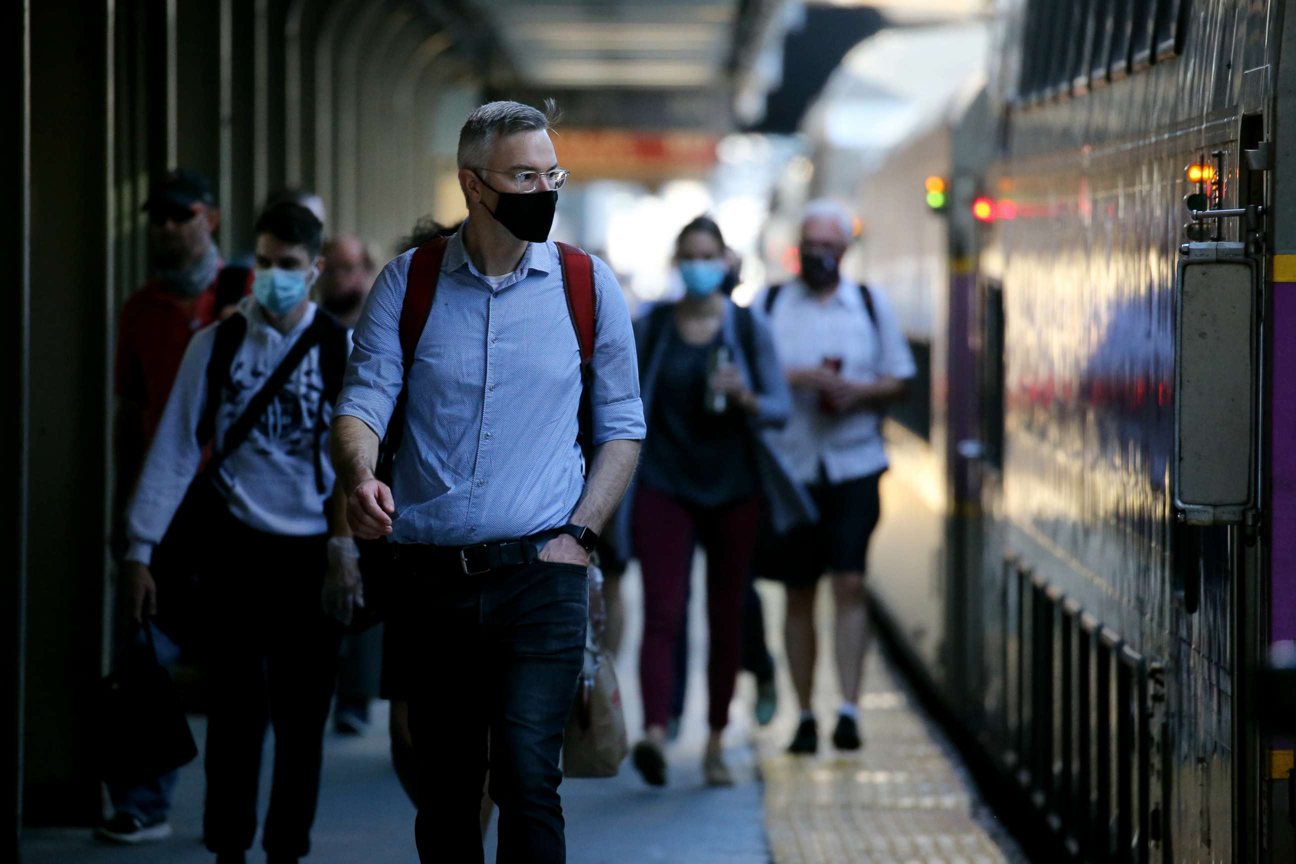 PHOTO: Commuters arrive at South Station in Boston, MA on July 14, 2020.