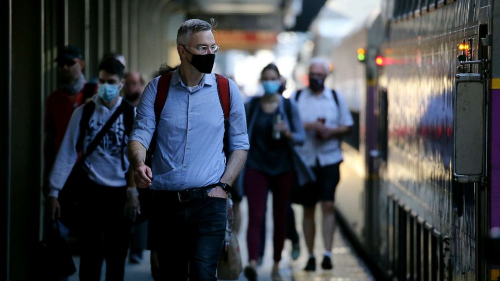 PHOTO: Commuters arrive at South Station in Boston, MA on July 14, 2020.
