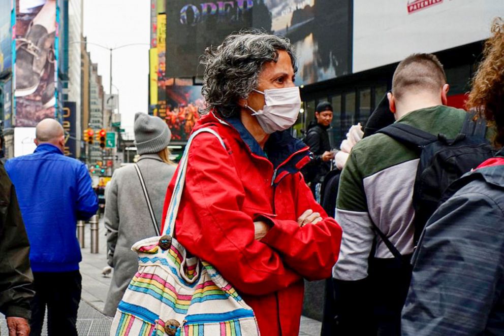 PHOTO: People wear face masks in Times Square on March 03, 2020 in New York City.