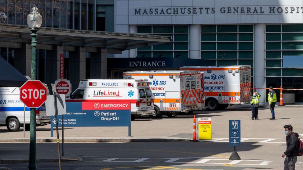 PHOTO: Ambulances are parked outside Massachusetts General Hospital, April 7, 2020, in Boston, during the coronavirus pandemic.