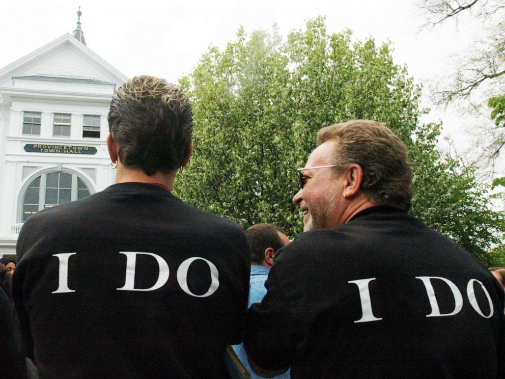 PHOTO: Two men wearing wait outside Town Hall, where same-sex couples from across the country gathered May 17, 2004, in Provincetown, Mass.