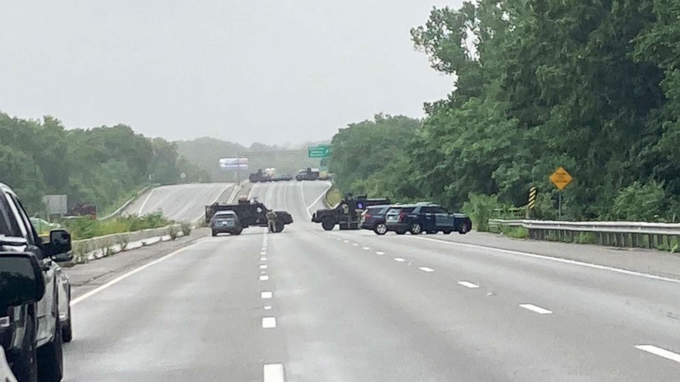 PHOTO: Massachusetts state police respond to group of armed men blocking Interstate 97  claiming to not recognize laws in the area of Wakefield, Mass., July 3, 2021.