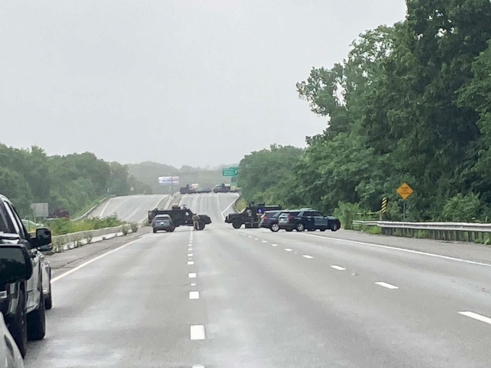 PHOTO: Massachusetts state police respond to group of armed men blocking Interstate 97  claiming to not recognize laws in the area of Wakefield, Mass., July 3, 2021.
