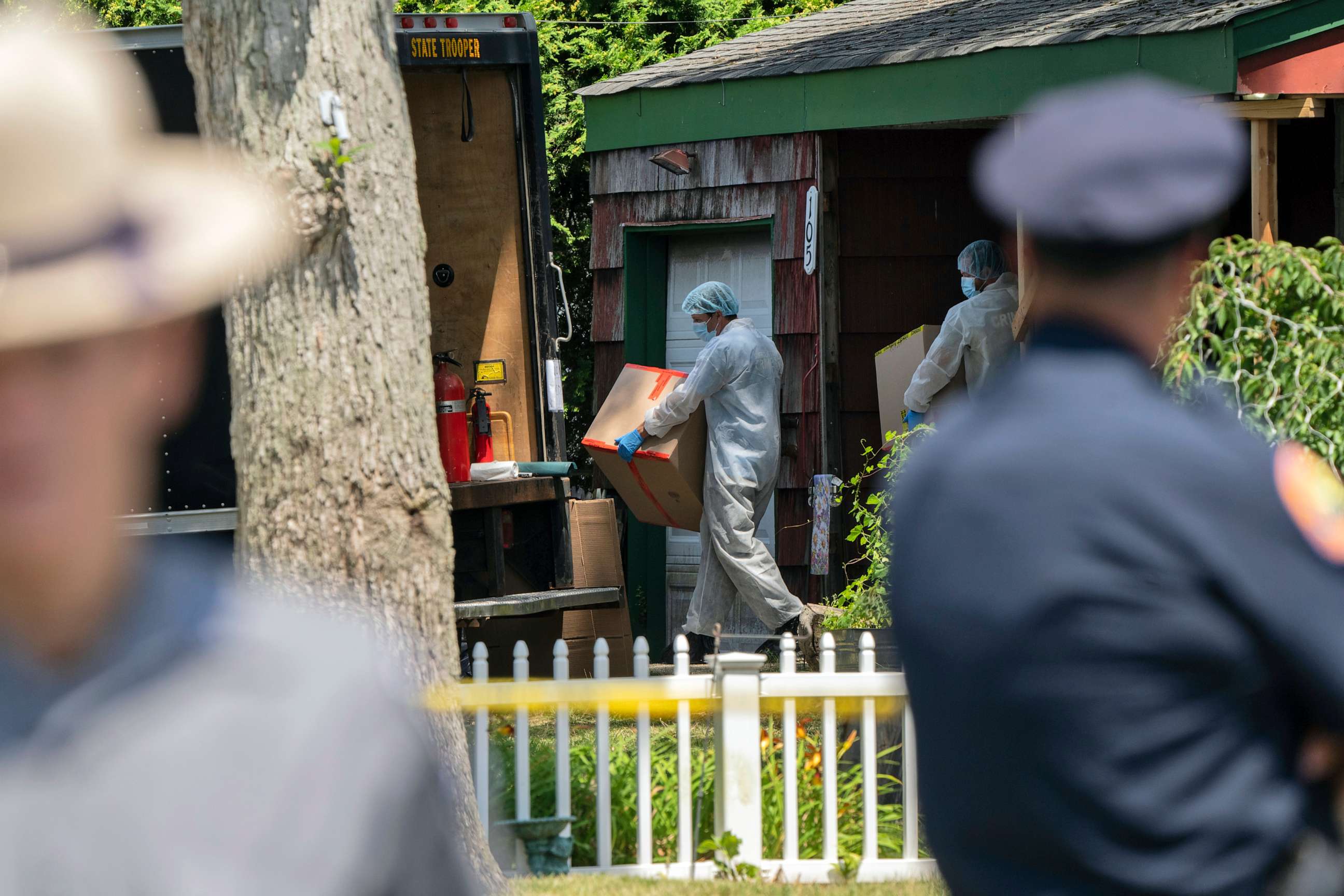 PHOTO: Crime laboratory officers removes boxes as law enforcement searches the home of Rex Heuermann, Saturday, July 15, 2023, in Massapequa Park, N.Y.