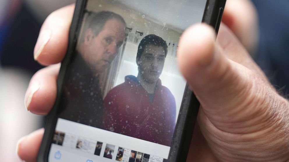 PHOTO: Paul Ventura, father of 18-year-old Mateo Ventura, both of Wakefield, Mass., displays a photograph on his cell phone that shows what he describes as a photo of himself and his son Mateo, right.