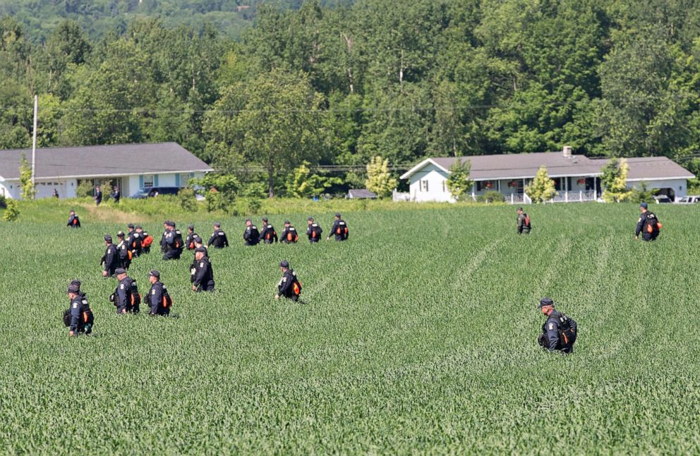 PHOTO: File photo: Corrections officers search a field as the manhunt for  convicted murderers Richard Matt and David Sweat continues on June 24, 2015 in Malone, New York.