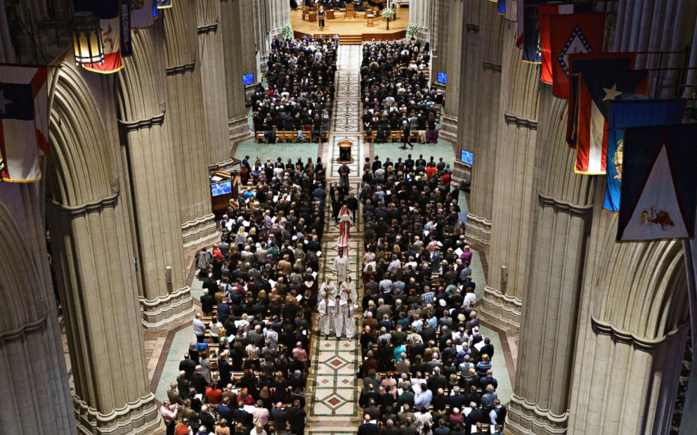 Dennis and Judy Shepard, Bishop LaTrelle Easterling, Rev. Mariann Budde, Reverend V. Gene Robinson, and the ashes of Matthew Shepard proceed down the aisle at the conclusion of a service at Washington National Cathedral in Washington, Oct. 26, 2018. 