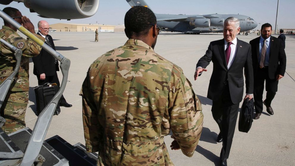 Defense Secretary James Mattis greets an airman as he boards a U.S. Air Force C-17 Globemaster for a day trip to a U.S. military base in Djibouti from Doha, Qatar, April 23, 2017.