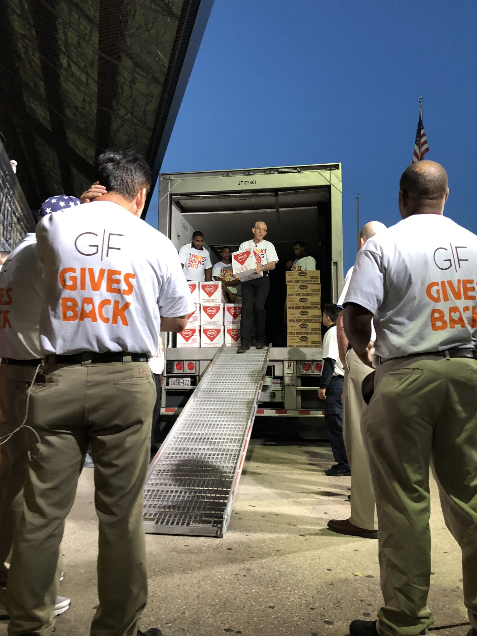 PHOTO: Gallery Furniture owner Jim McIngvale helps unload food to prepare for the Thanksgiving dinner he is hosting in Houston, Nov. 22, 2017.