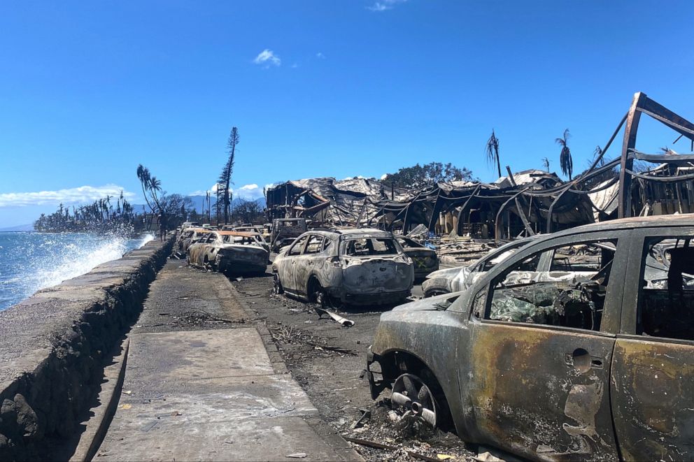 PHOTO: Burned cars and destroyed buildings are pictured in the aftermath of a wildfire in Lahaina, western Maui, Hawaii on August 11, 2023. A wildfire that left Lahaina in charred ruins has become one of deadliest disasters in the U.S. state's history.