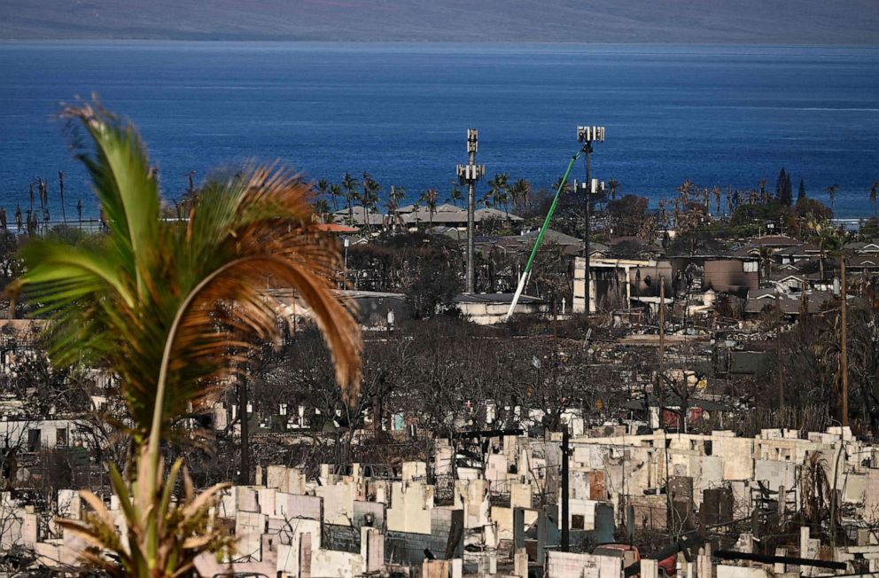 PHOTO: Utility workers repair cell phone service towers in the aftermath of the Maui wildfires in Lahaina, Hawaii, on Aug. 16, 2023.