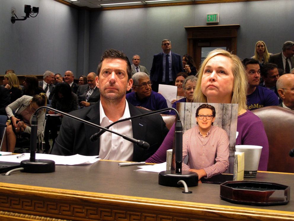 PHOTO: In this March 21, 2018 file photo, Stephen and Rae Ann Gruver sit in a House committee room behind a photo of their son, Maxwell Gruver, a LSU freshman who died with a blood-alcohol content six times higher than the legal limit, in Baton Rouge, La.