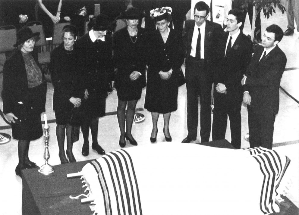 PHOTO: Members of the immediate family of the late Robert Maxwell stand behind the body laying on a stretcher during the funeral service in Jerusalem's main convention hall, Nov. 10, 1991. 