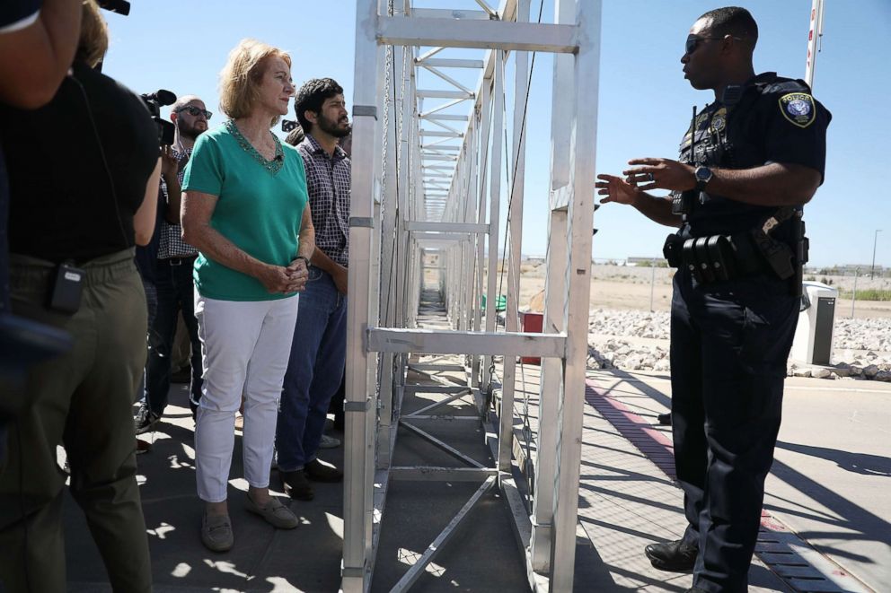 PHOTO: Police officer as she is told she cannot cross through the gate to the tent facility setup at the Tornillo-Guadalupe Port of Entry as she joins with other mayors, June 21, 2018 in Fabens, Texas.