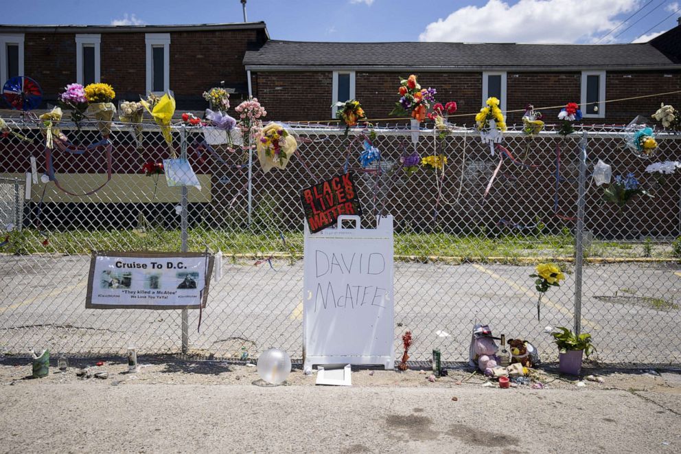 PHOTO: A makeshift memorial for David McAtee along a fence outside the location where he was shot and killed by police in the early hours of June 6, 2020, in Louisville, Ky.